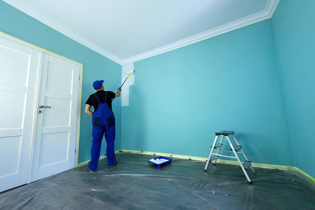 Professional interior painter in Quechee, VT applying a coat of paint