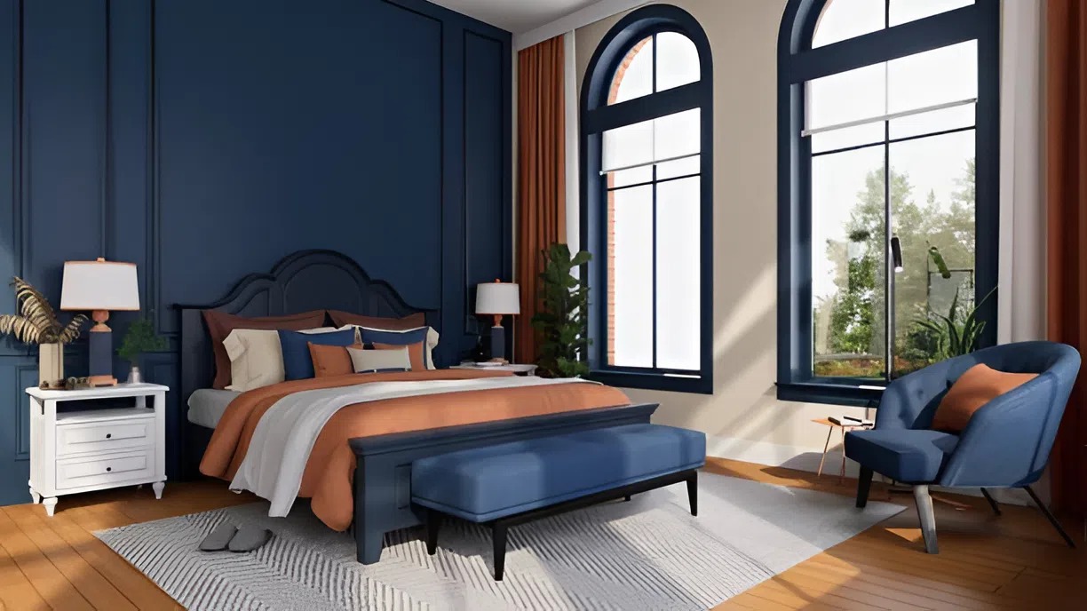 Bedroom with deep blue accent walls and soft neutral trim by an interior painter in Grantham, NH