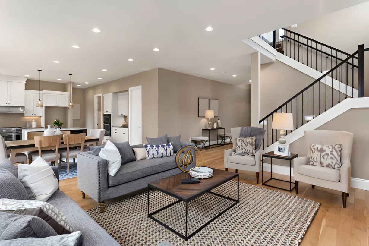Warm neutral interior paint colors in an open-concept living space by a house painter in Norwich, VT