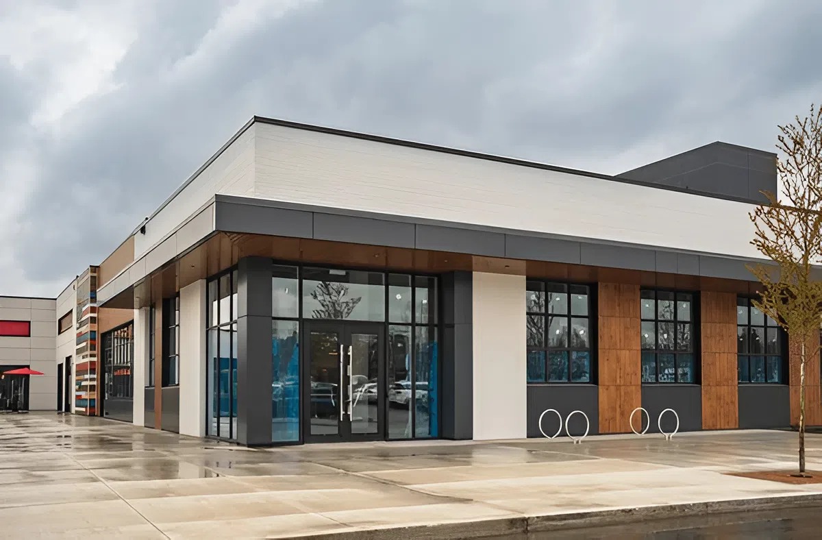Modern commercial building exterior with clean white and charcoal paint finishes by a painting company in New London, NH