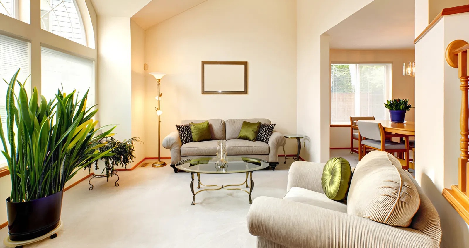 Cohesive living room with soft neutral walls, large windows, and coordinated decor by a painter in Newbury, NH