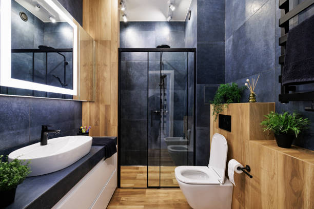 Contemporary bathroom with blue-gray painted walls and natural wood finishes by an interior painter in Grantham, NH