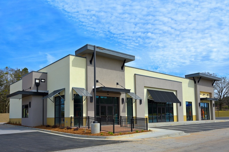 Commercial exterior with modern neutral tones and clean architectural finishes by an exterior painter in Sunapee, NH